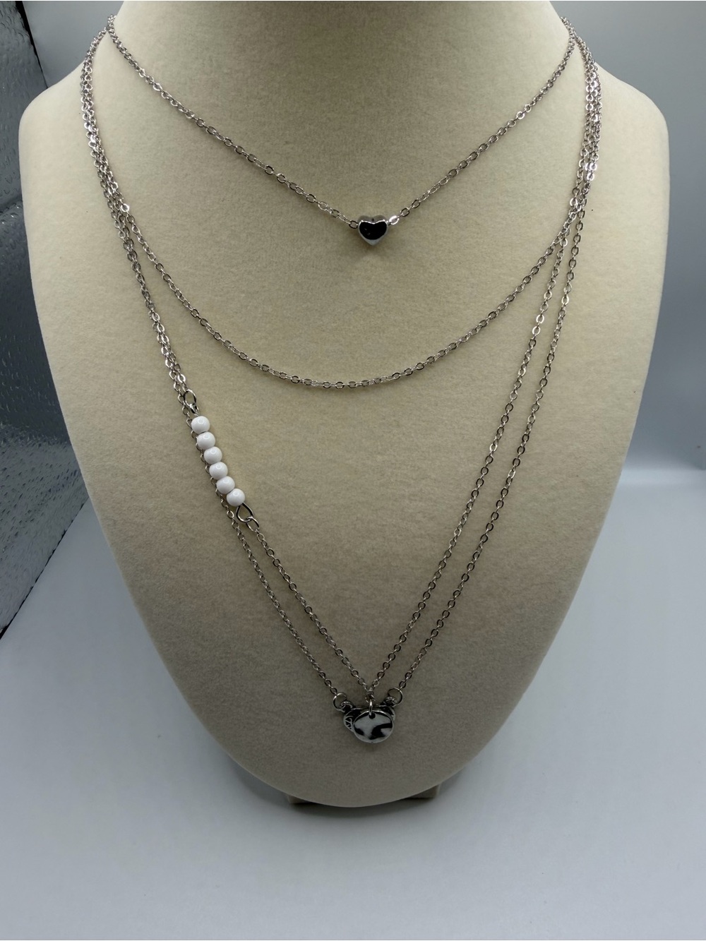 Layered Silver Heart Pendant Necklace with White Bead Accent